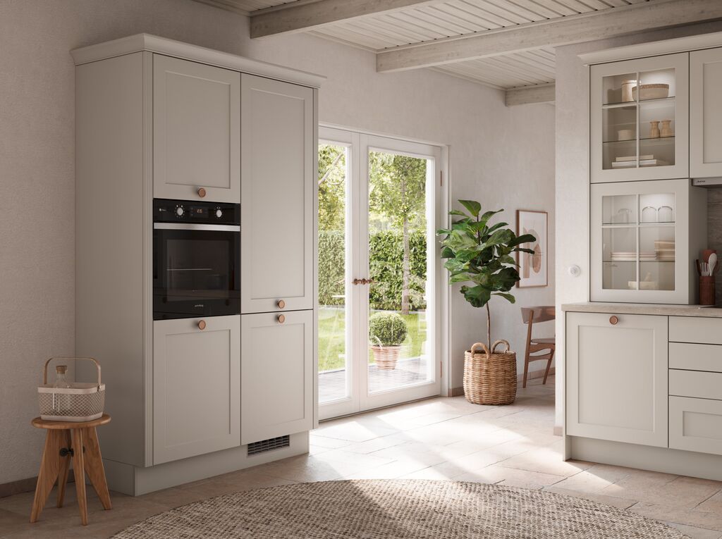Impuls IP 4250 shaker tall units in cashmere with copper knobs beside garden doors