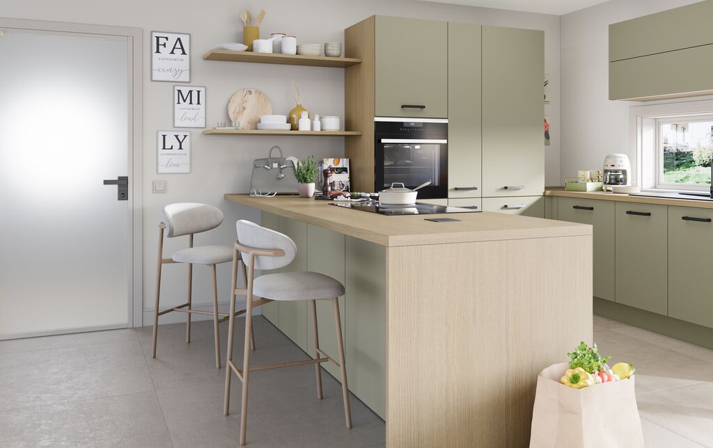 Impuls IP 2200 sage green kitchen with a light oak breakfast bar peninsula and tall oven housing