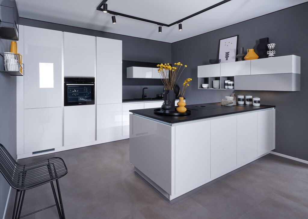 Impuls IP 4050 kitchen in high-gloss white with a dark stone island top