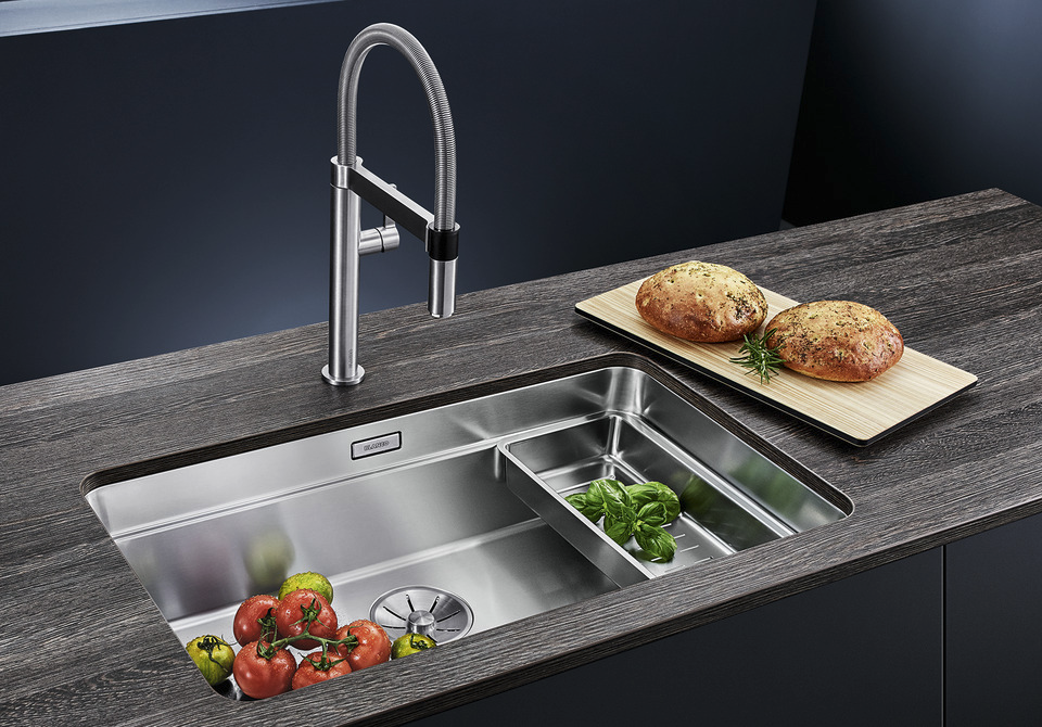 Blanco undermounted stainless steel sink with drainer tray and brushed steel pull-out mixer tap in a timber-effect worktop