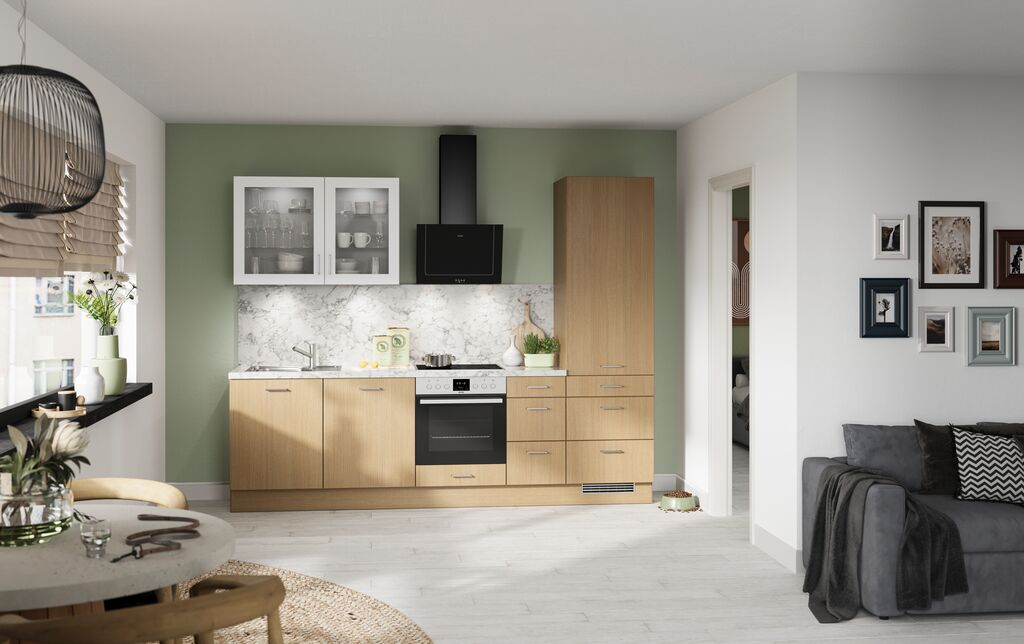 Impuls IP 2200 light oak effect single-run kitchen with glazed wall cabinets against a sage green wall