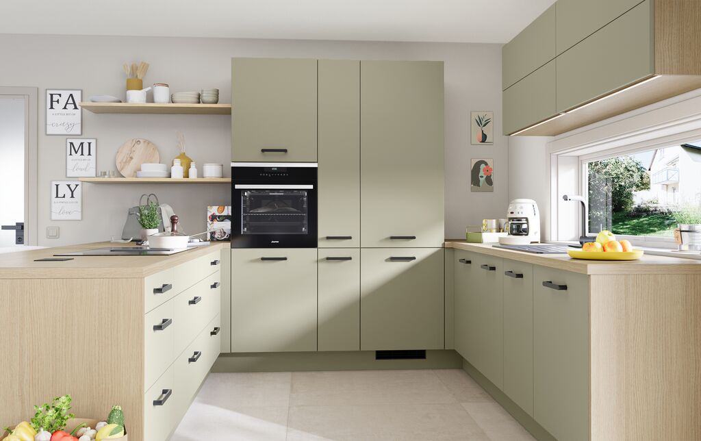 Impuls IP 2200 kitchen in matt sage green with light oak effect cabinetry and worktop