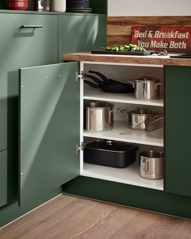 Impuls IP 1200 green base cupboard opened to show adjustable shelves and pan storage